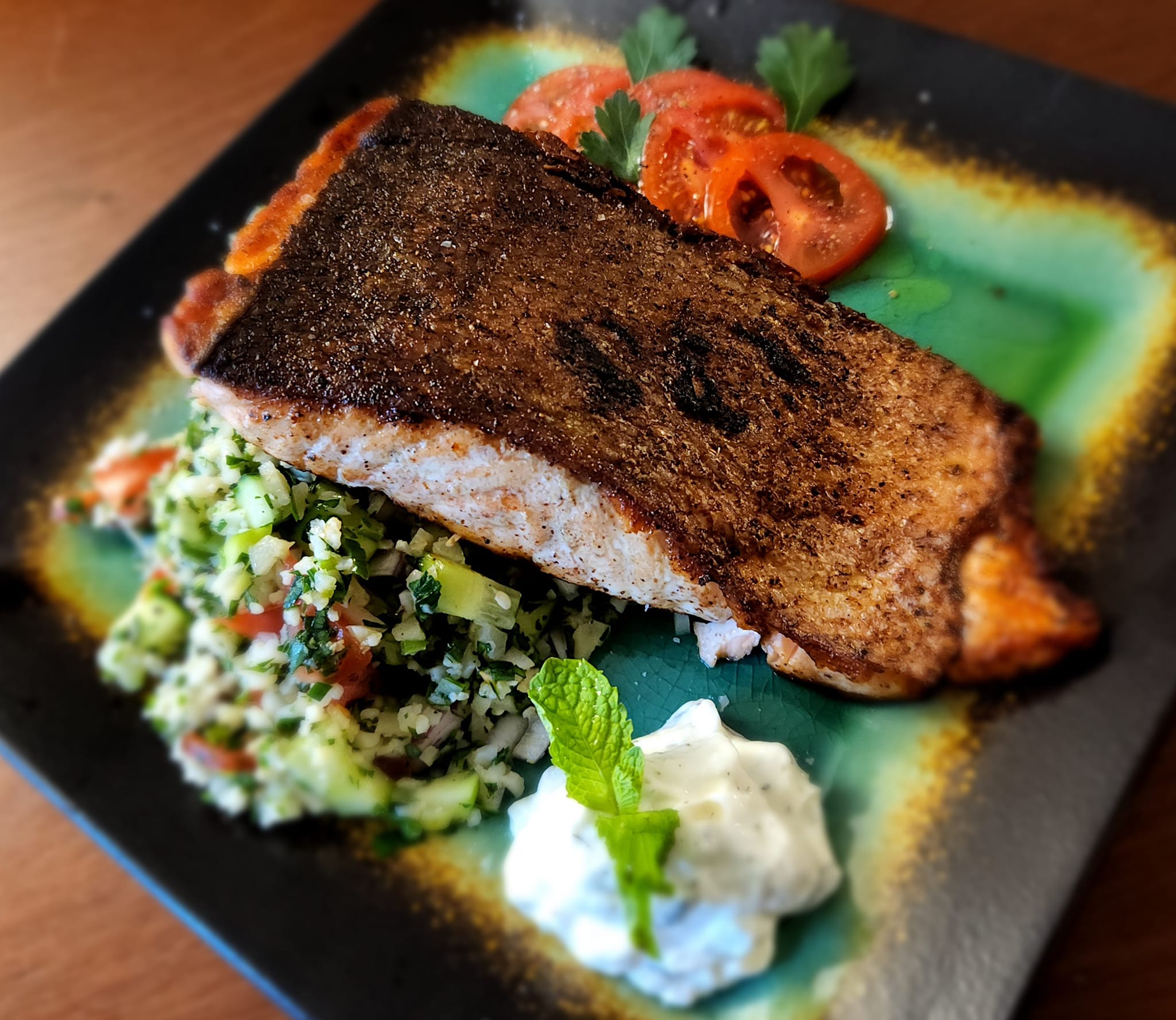 Crispy-skin salmon served with cauliflower tabouleh.